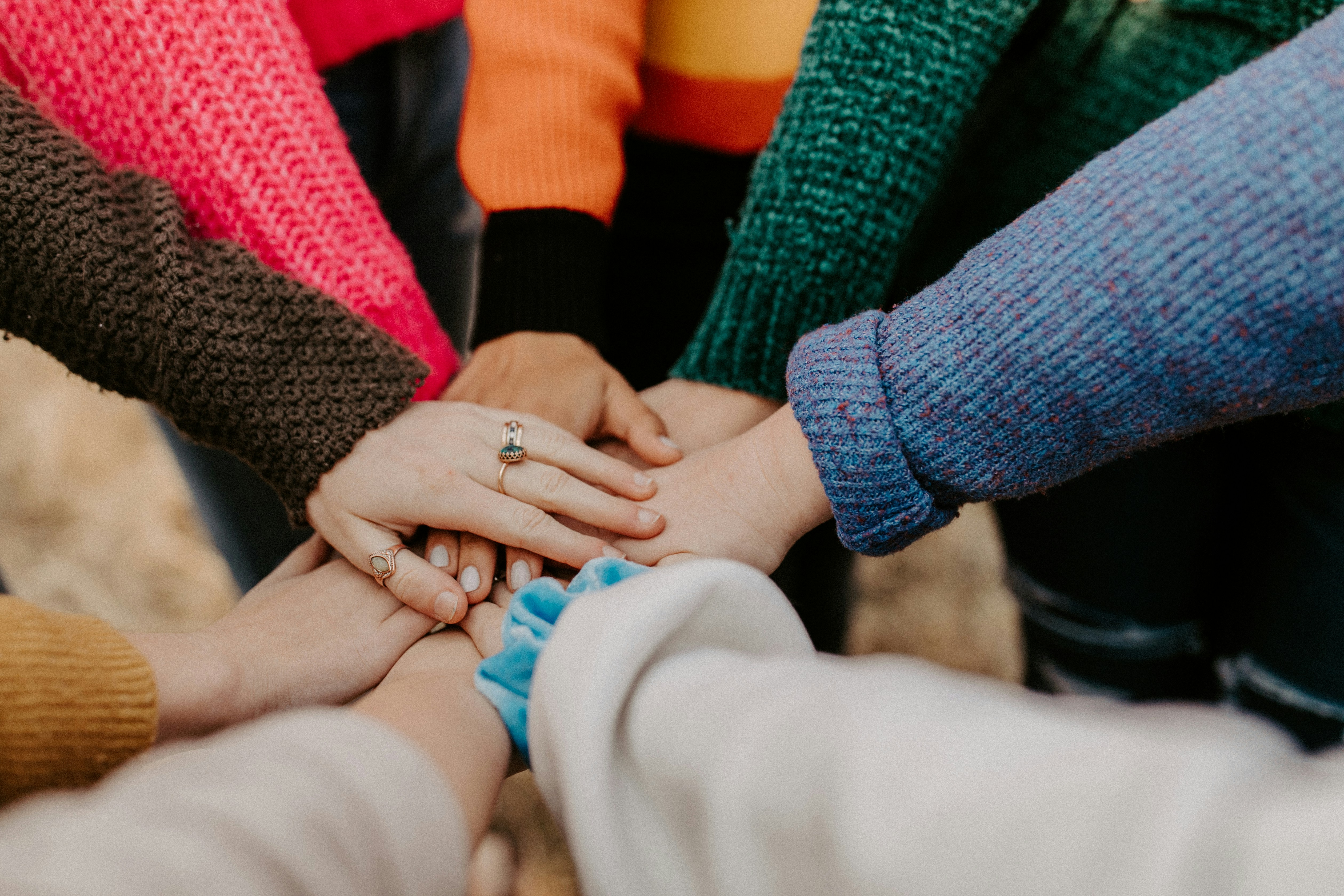 Community group holding hands symbolizing connection and support